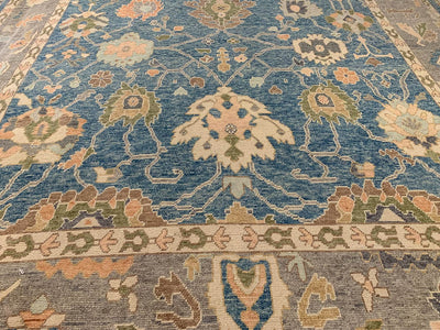 A blue & green Oushak Turkish area rug.