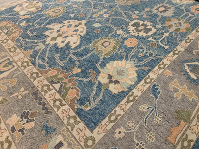 A blue & green Oushak Turkish area rug.