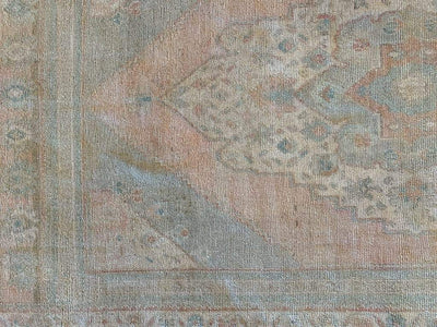 Corner shot of medium sized blue/green Sivas Turkish Rug.