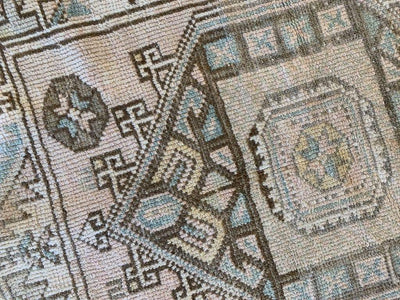 Central medallion on a small brown and grey Sivas Turkish rug.