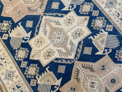 Central medallion on a blue & green large sivas Turkish Rug.