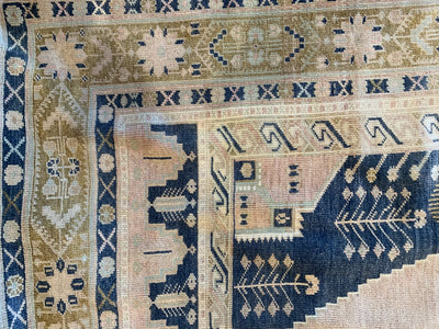 Close up on the corner of a blue & green medium Sivas Turkish Rug.