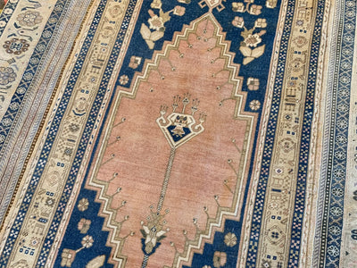 Central red medallion on a blue & green medium Sivas Turkish Rug