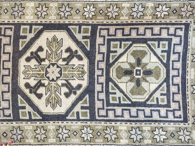 Central medallions on a blue & green Oushak Turkish runner.