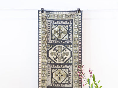 Hanging blue & green Oushak Turkish rug.