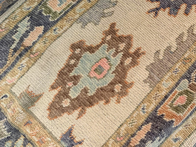 Central medallion on a blue & green Turkish runner rug.
