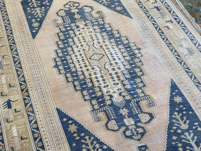 Large central medallion on a blue & green Sivas Turkish Rug runner.