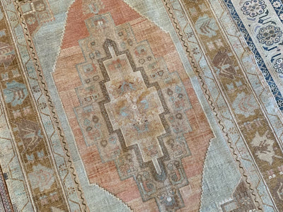Central medallion on a brown & grey medium Sivas Turkish Rug.