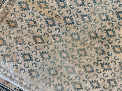 Corner of a brown & grey small Sivas Turkish Rug.