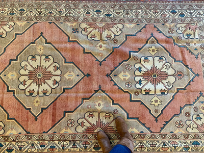 Central medallions on a large red & orange Konya Turkish rug.