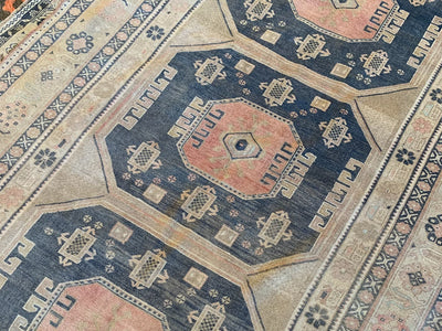 Central red eye medallion on a brown & grey large Sivas Turkish Rug.