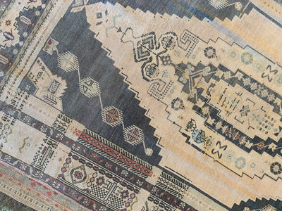 Large central medallion on a large brown & grey Sivas Turkish Rug.