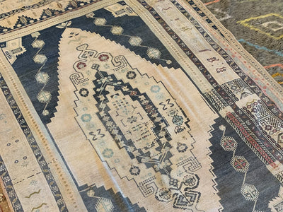 Large central medallion on a large brown & grey Sivas Turkish Rug.