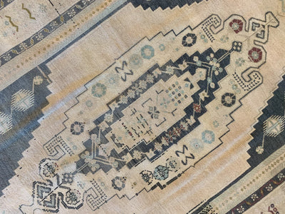 Central medallion on a large brown & grey Sivas Turkish Rug.