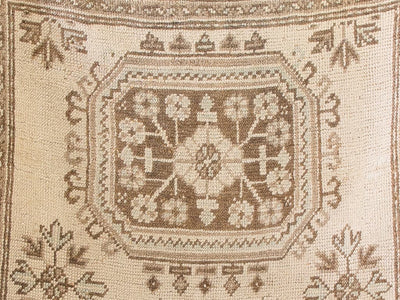 Center of brown & grey Oushak Turkish rug runner.