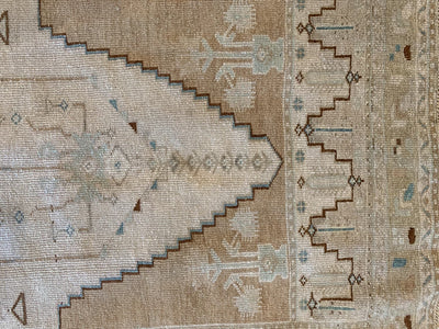 Traditional symbols and motifs on a brown & grey small Sivas Turkish Rug.