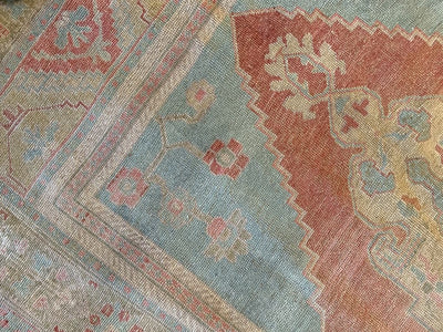 Corner shot of an extra large red & orange Sivas Turkish Rug.