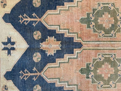 Center matching arches on medium blue green Sivas Turkish Rug.