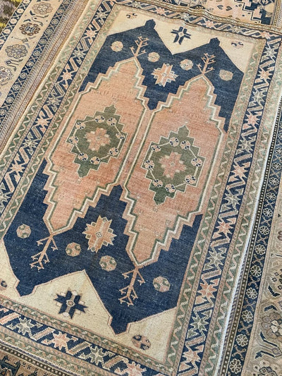 Top down shot of medium sized blue green Sivas Turkish Rug.