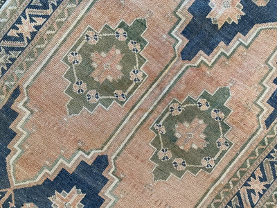 Center two medallions on medium blue green Sivas Turkish Rug.