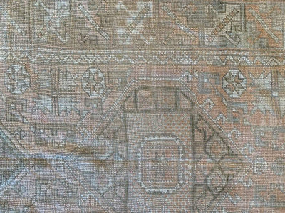 Center medallion on amedium brown and grey Sivas Turkish rug.