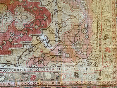 Close up of knotting on a medium red & orange Guney Turkish rug.