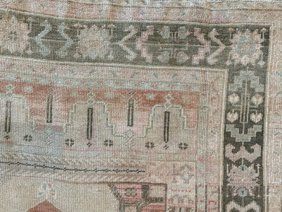 Corner of a red & orange medium Sivas Turkish Rug.