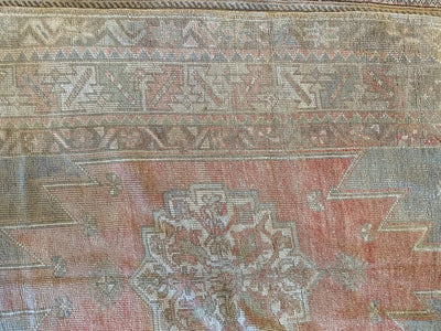 Close up of knotting on ared & orange small Bor Turkish Rug.