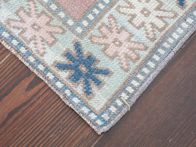 Corner of red & orange varosha Turkish rug runner.