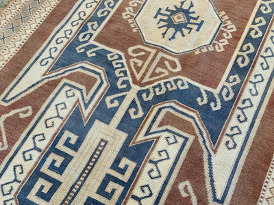 Close up of knott work on a blue & green extra large Kars Turkish Rug.