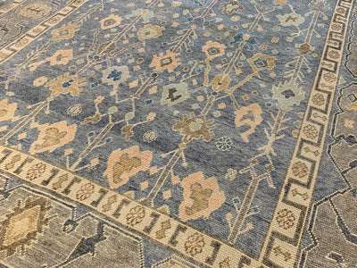 A blue & green Oushak Turkish area rug.