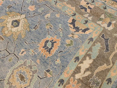 Corner motif on a blue & green area rug Oushak Turkish Rug.