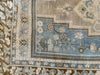 Corner knotting and antiqued wear on a blue & green extra large Sivas Turkish Rug