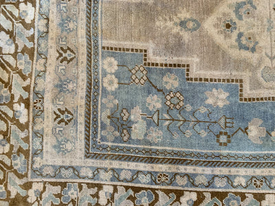 Corner knotting and antiqued wear on a blue & green extra large Sivas Turkish Rug