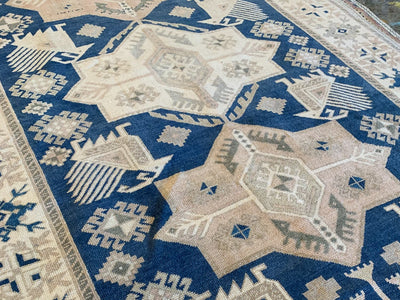 Central medallions on a blue & green large sivas Turkish Rug.