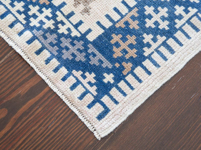 Corner of a blue & green medium sized Sivas Turkish rug.