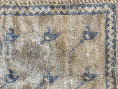 Corner border and close up of repeating motif on a blue & green small Sivas Turkish Rug.
