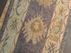 Central motif on a blue & green Turkish runner rug.