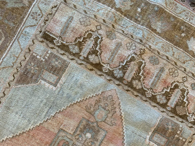 Close up of knotting on the corner of a brown & grey medium Sivas Turkish Rug.