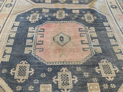One of three large square medallions on a brown & grey large Sivas Turkish Rug.