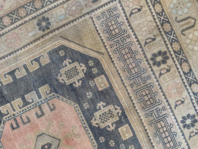 Close up of knotting work on a brown & grey large Sivas Turkish Rug.