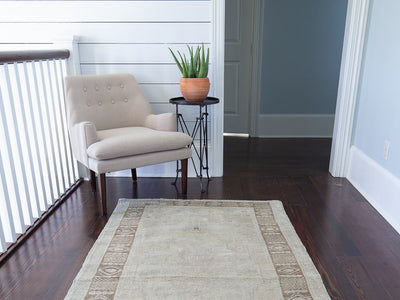 Sitting area with brown & grey medium sized Sivas Turkish rug.