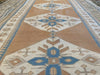 Long view of a brown & grey Sultahan runner Turkish rug.