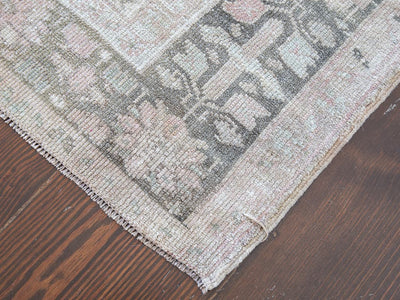 Corner of a brown & grey medium sized Sivas Turkish rug.