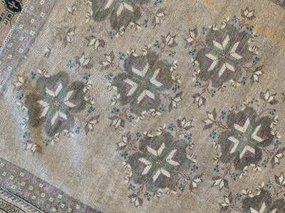 Close up of knot work on a brown & grey small Sivas Turkish Rug.