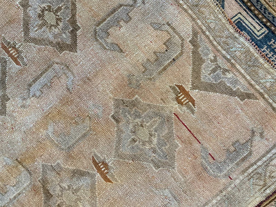 Close up of knott work and motifs on a brown & grey medium Sivas Turkish Rug.