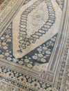 Side shot of an extra large brown & grey Sivas Turkish rug.