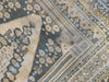 Corner close up of an extra large brown & grey Sivas Turkish rug.