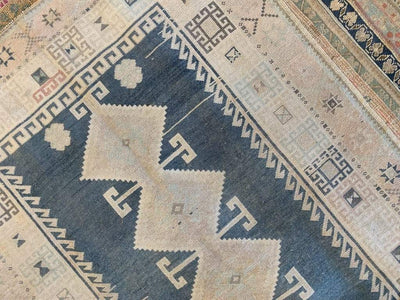Geometric patterns on a brown & grey Sivas Turkish rug.