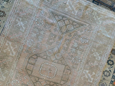 Corner of a medium brown and grey Sivas Turkish rug.